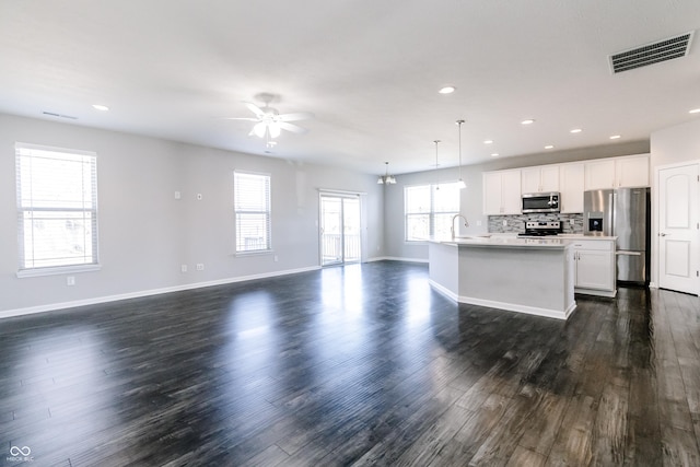 6117 Arctic Cir, Indianapolis, IN 46237 - living area featuring dark wood-type flooring, ceiling fan, baseboards, and recessed lighting