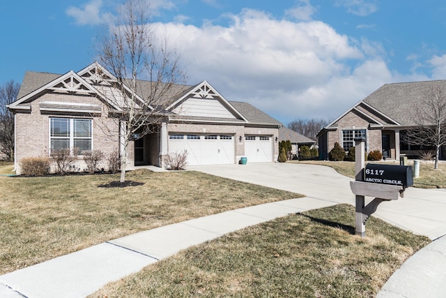 craftsman-style home featuring an attached garage, driveway, a front lawn, and brick siding