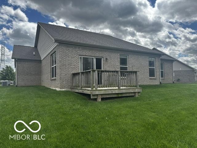 6117 Arctic Cir, Indianapolis, IN 46237 - back of property with brick siding, a wooden deck, and a yard