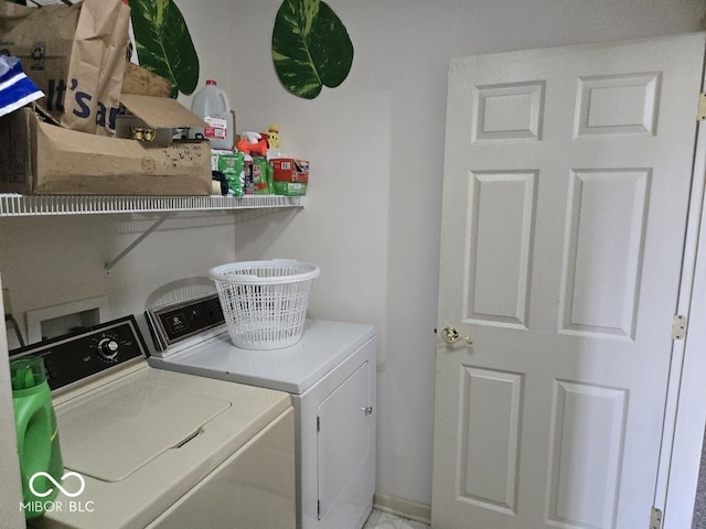 washroom with laundry area and independent washer and dryer