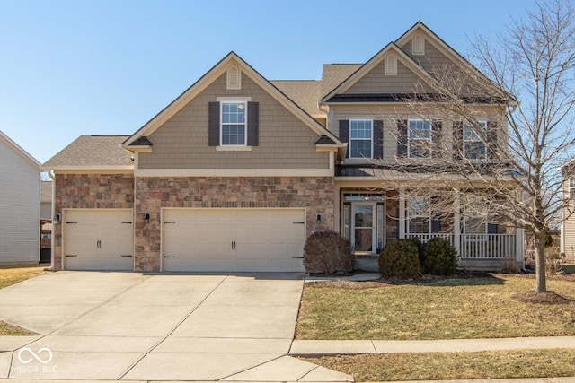 craftsman-style house with concrete driveway, covered porch, an attached garage, a front yard, and stone siding
