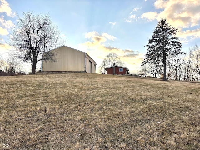 view of yard featuring an outbuilding and an outdoor structure