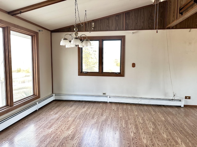 empty room featuring vaulted ceiling, a notable chandelier, wood finished floors, and baseboard heating