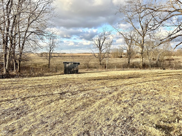 view of yard with a rural view