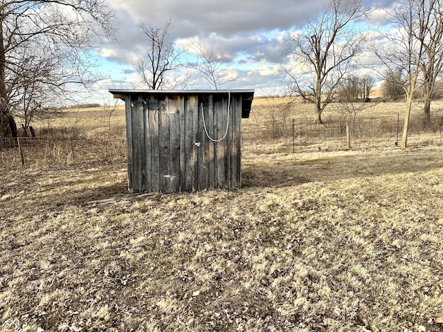 view of shed with fence