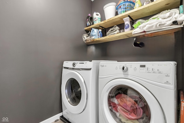 laundry room featuring baseboards, laundry area, and washer and dryer