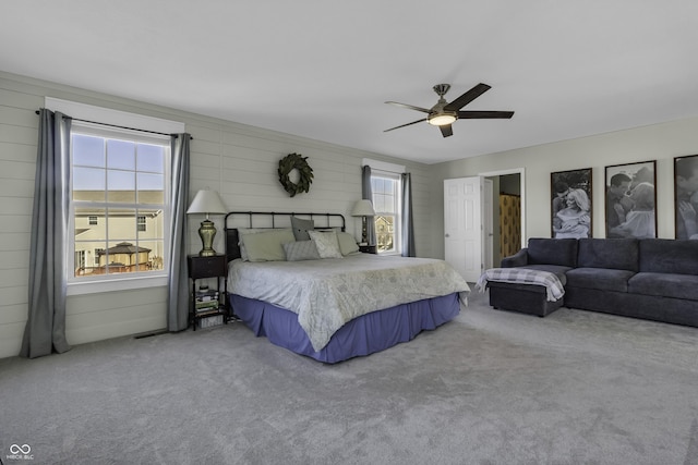 carpeted bedroom featuring ceiling fan