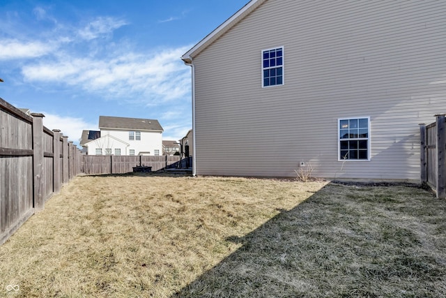 view of home's exterior featuring a fenced backyard and a lawn