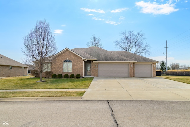 ranch-style home with a garage, brick siding, driveway, and a front lawn