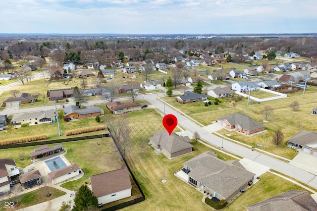 birds eye view of property with a residential view