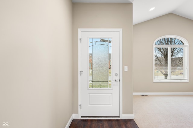 entryway featuring lofted ceiling, visible vents, baseboards, and recessed lighting