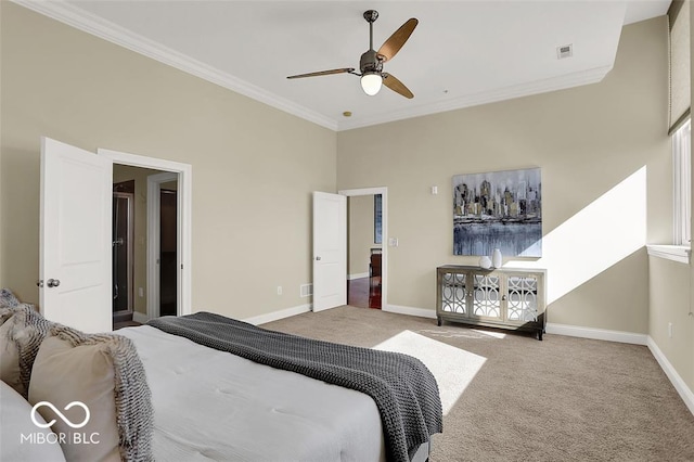 bedroom featuring ornamental molding, carpet, and baseboards