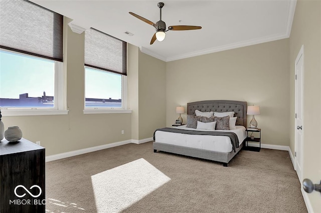 bedroom featuring carpet floors, visible vents, ornamental molding, ceiling fan, and baseboards