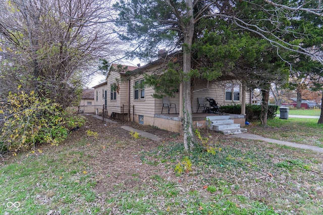 view of side of home with fence