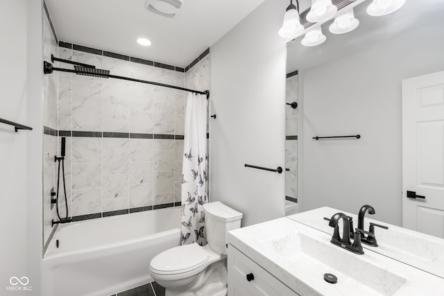 bathroom featuring toilet, shower / tub combo, visible vents, and vanity