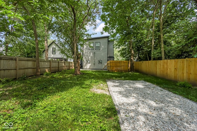 view of yard with a fenced backyard