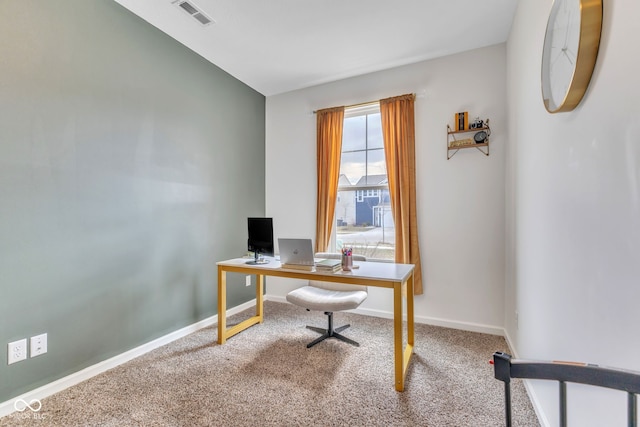 carpeted office space featuring baseboards and visible vents