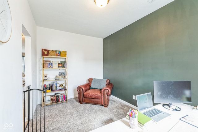carpeted home office featuring baseboards