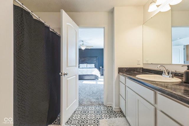 ensuite bathroom with tile patterned flooring, ensuite bathroom, and vanity