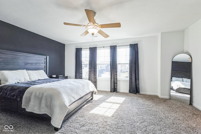 bedroom featuring carpet, baseboards, and a ceiling fan