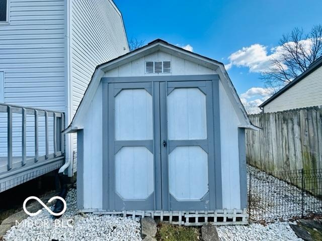 view of shed with fence