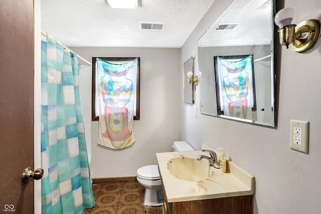 bathroom featuring toilet, curtained shower, visible vents, and a textured ceiling