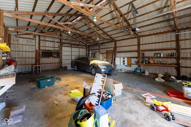 garage featuring metal wall and a garage door opener