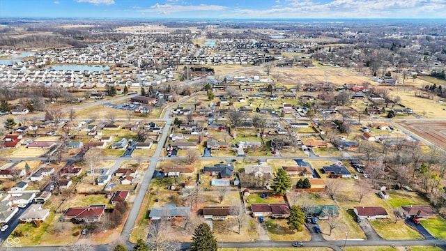 bird's eye view featuring a water view and a residential view