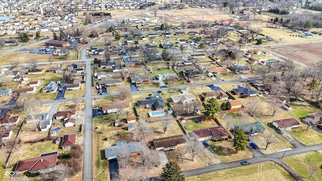 birds eye view of property with a residential view