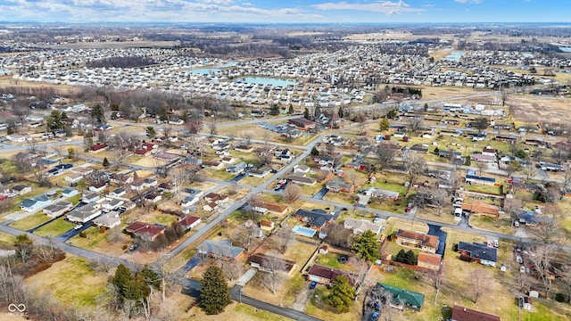 drone / aerial view featuring a water view and a residential view