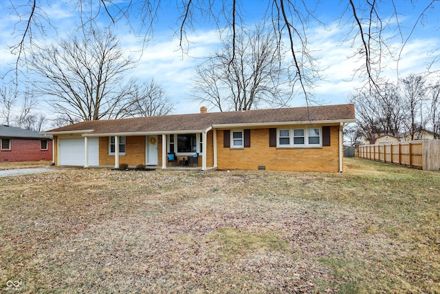 view of front facade featuring brick siding, a chimney, an attached garage, crawl space, and fence