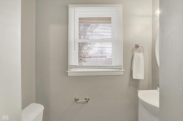 half bath with toilet and vanity