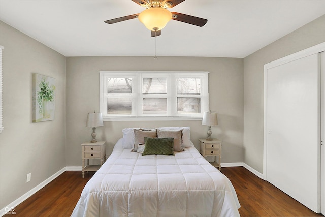 bedroom featuring dark wood finished floors, baseboards, and ceiling fan