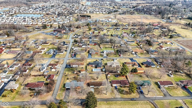 drone / aerial view with a water view and a residential view