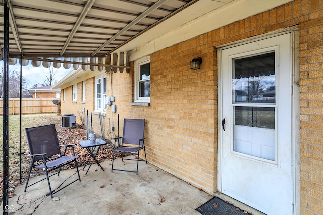 view of patio / terrace featuring fence