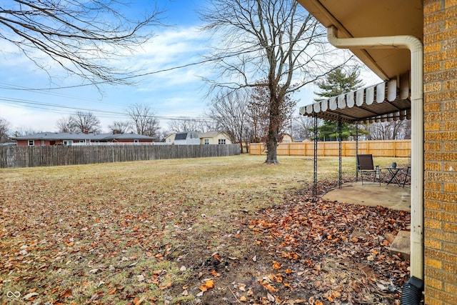 view of yard featuring a patio area and fence