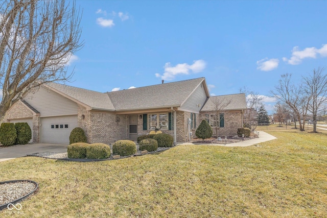 view of front facade featuring a garage, concrete driveway, roof with shingles, a front yard, and brick siding