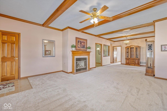 unfurnished living room featuring crown molding, a tile fireplace, carpet flooring, and beamed ceiling