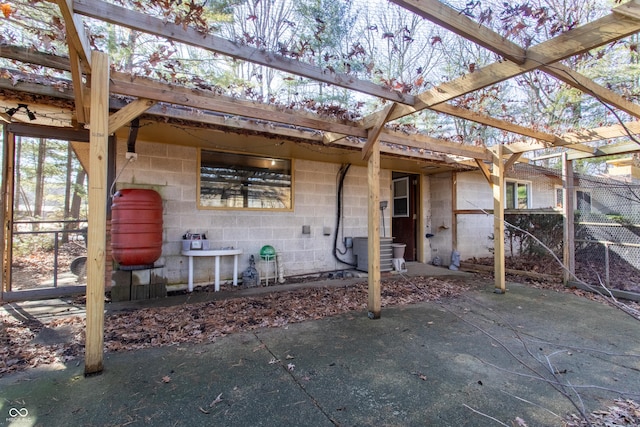 view of patio / terrace featuring fence and a pergola