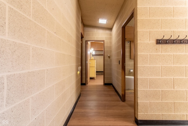 corridor featuring wood finished floors