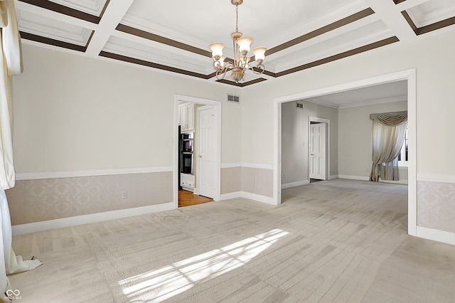 spare room featuring coffered ceiling, visible vents, and beamed ceiling