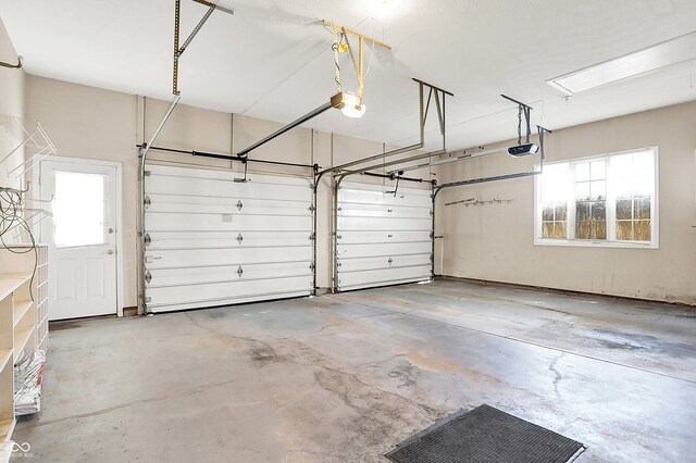 garage featuring a garage door opener