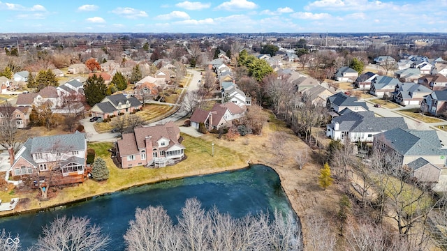 birds eye view of property with a residential view and a water view