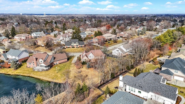 birds eye view of property featuring a water view and a residential view