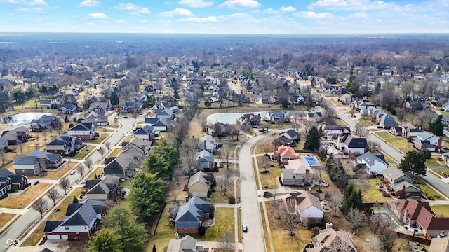 birds eye view of property with a residential view