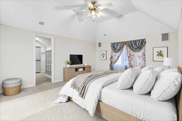 bedroom featuring vaulted ceiling, a spacious closet, visible vents, and baseboards