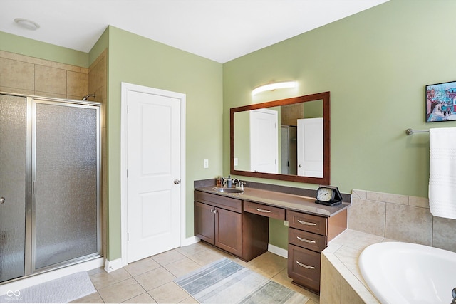 full bathroom featuring tile patterned flooring, a garden tub, a shower stall, and vanity