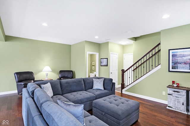 living area with baseboards, stairway, and dark wood finished floors