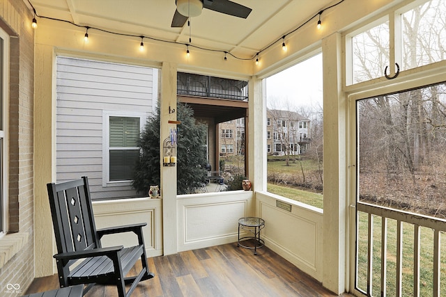 sunroom with rail lighting and ceiling fan