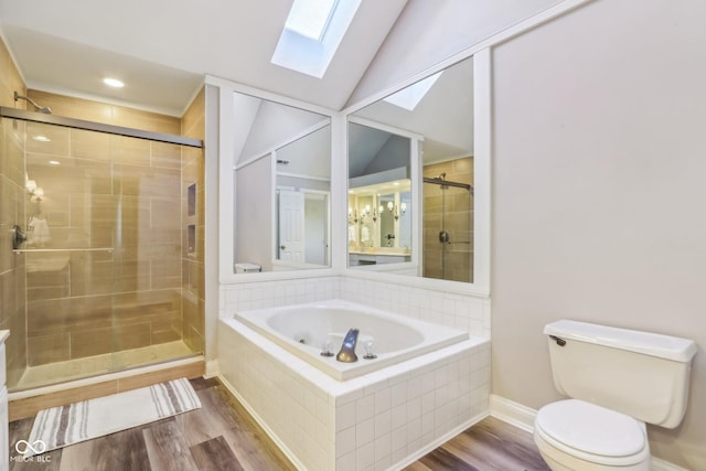 full bathroom with vaulted ceiling with skylight, a stall shower, wood finished floors, and toilet